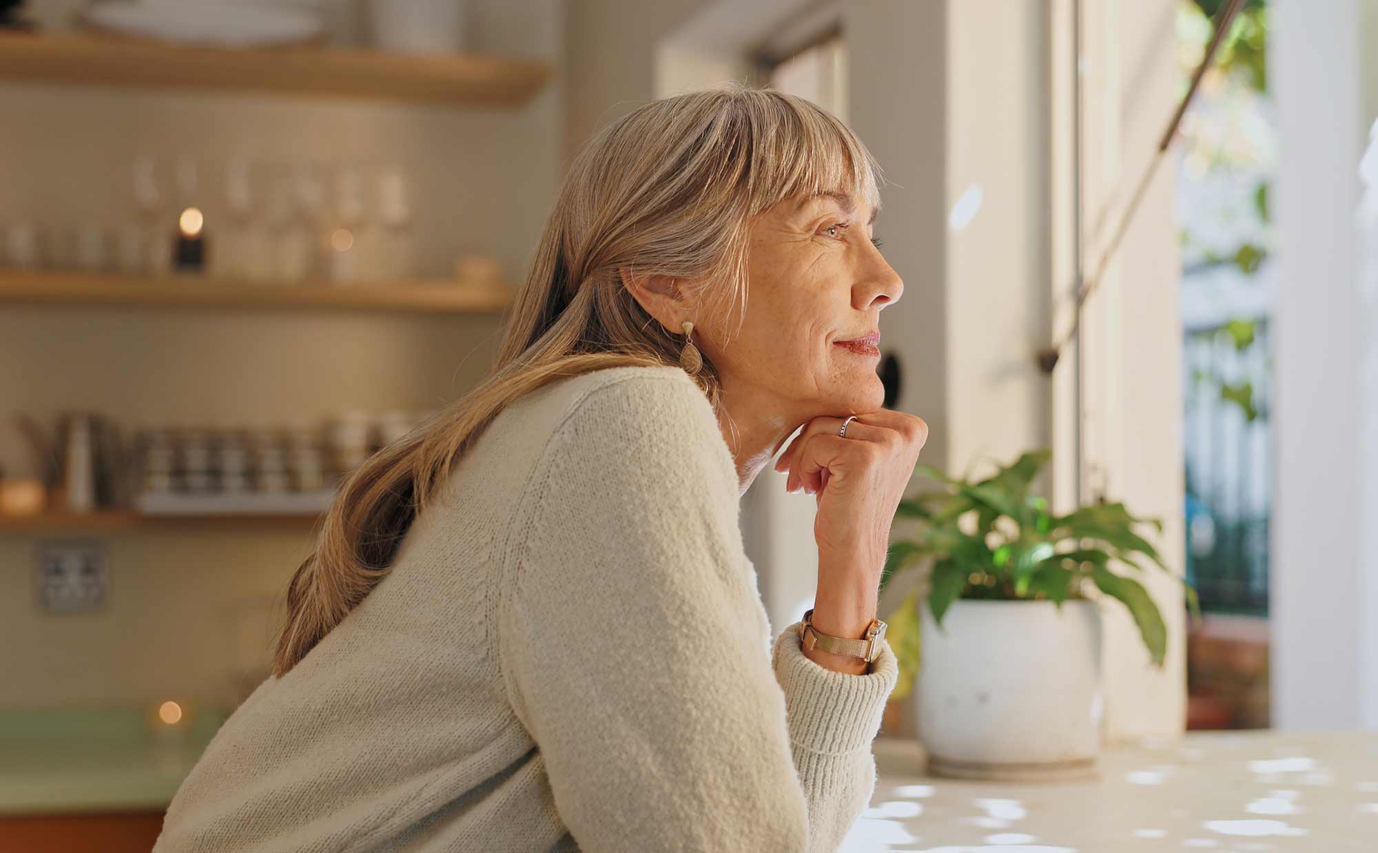 smile and elderly woman with thinking at home for retirement, satisfaction and peace on weekend